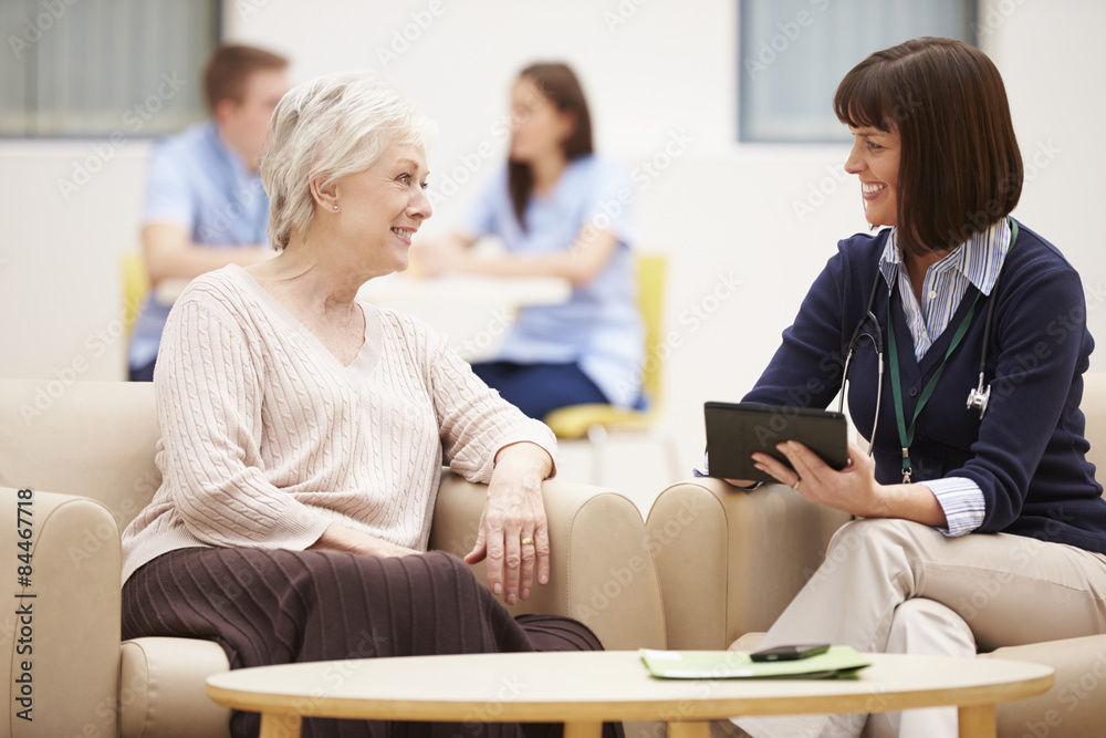 Senior Woman Discussing Test Results With Doctor