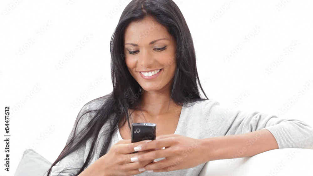 Happy girl texting a message with phone Happy girl texting a message with phone