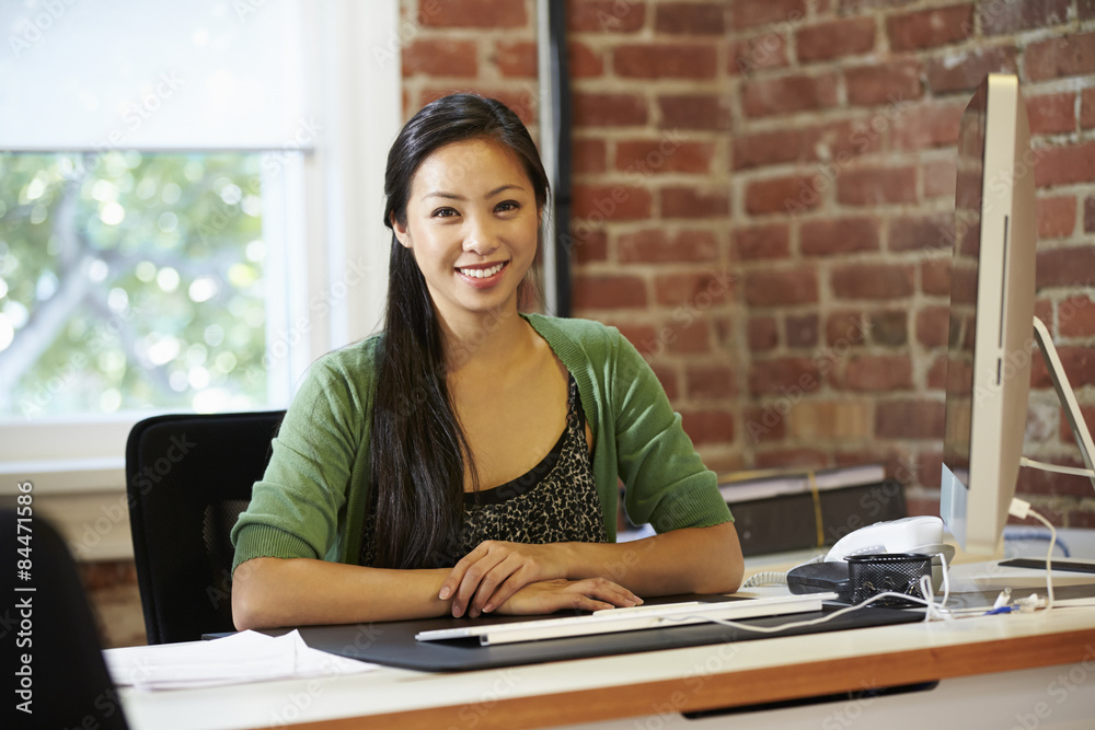 Woman Working At Computer In Contemporary Office Woman Working At Computer In Contemporary Office