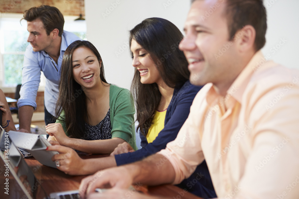 Businessmen And Businesswomen Meeting To Discuss Ideas Businessmen And Businesswomen Meeting To Discuss Ideas