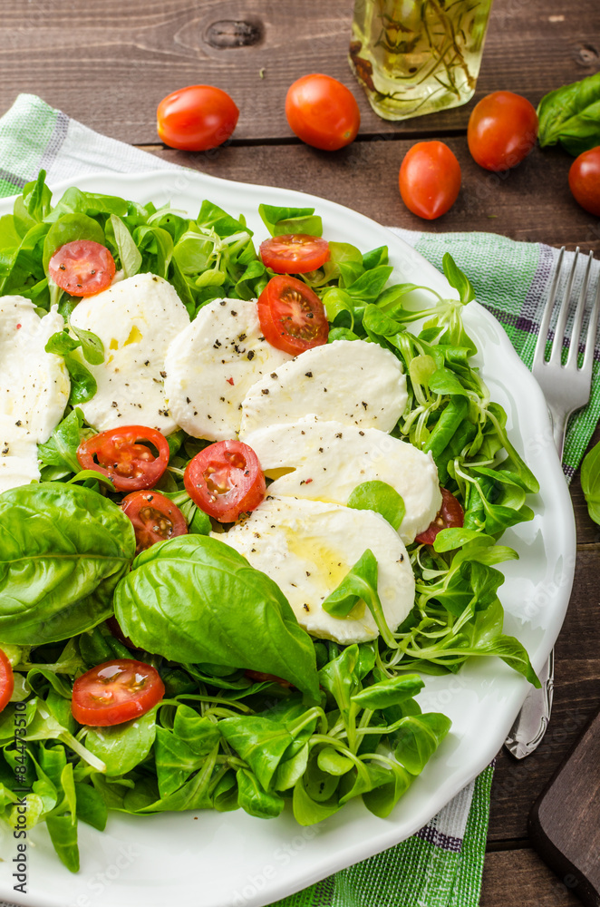 Lamb's lettuce salad with mozzarella, tomato and basil Lamb's lettuce salad with mozzarella, tomato and basil