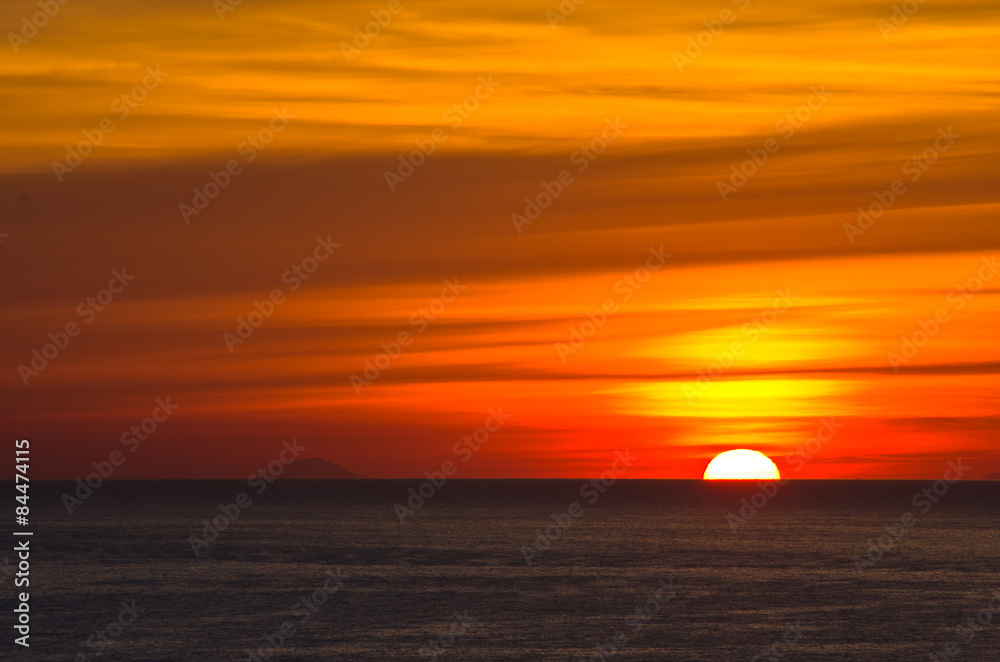 Sunrise over sea at Sicily, Lipari islands on a horizon Sunrise over sea at Sicily, Lipari islands on a horizon