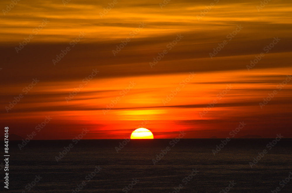 Sunrise over sea at Sicily, Lipari islands on a horizon