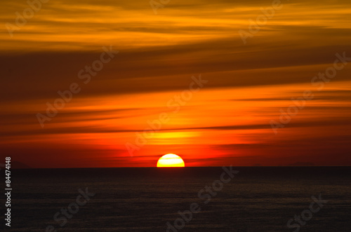 Sunrise over sea at Sicily, Lipari islands on a horizon © banepetkovic