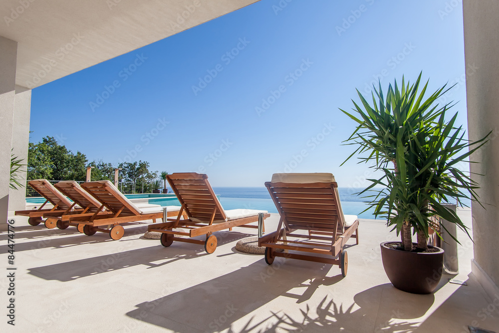 Luxury swimming pool and deck chair