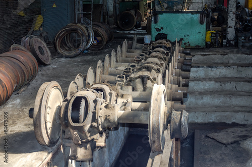 The wheels of a tram on rails in the repair depot