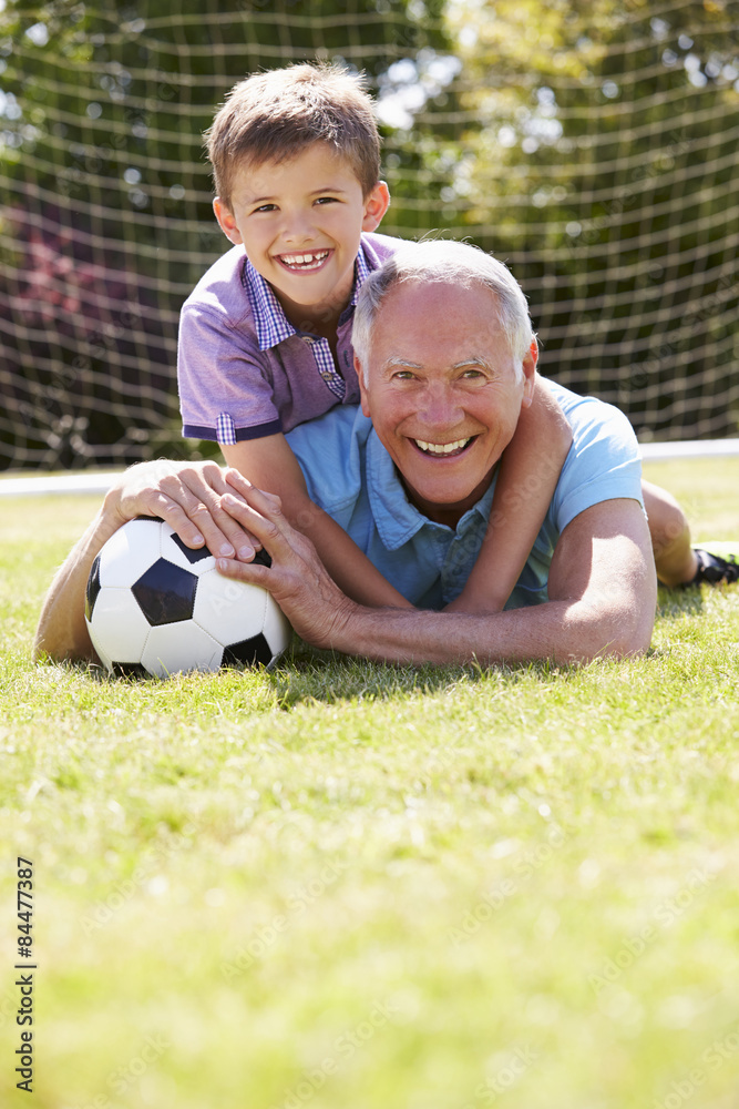 Portrait Of Grandfather And Grandson With Football Portrait Of Grandfather And Grandson With Football