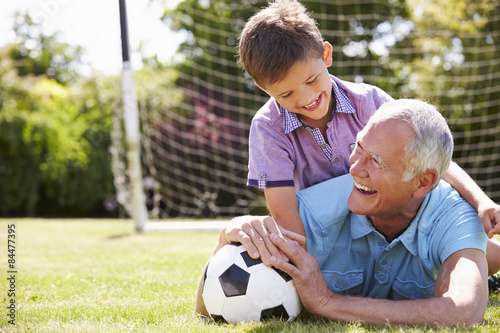 Portrait Of Grandfather And Grandson With Football © Monkey Business
