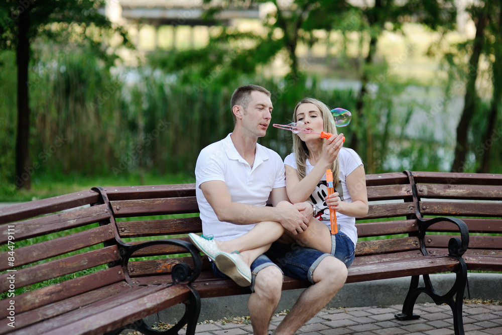 couple blow bubbles