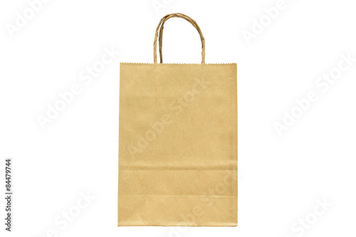 Brown paper shopping bag with handles over on white background.