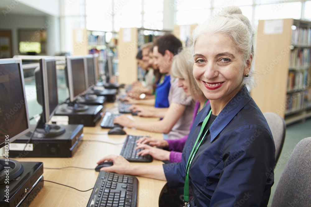 Group Of Mature Students Working At Computers