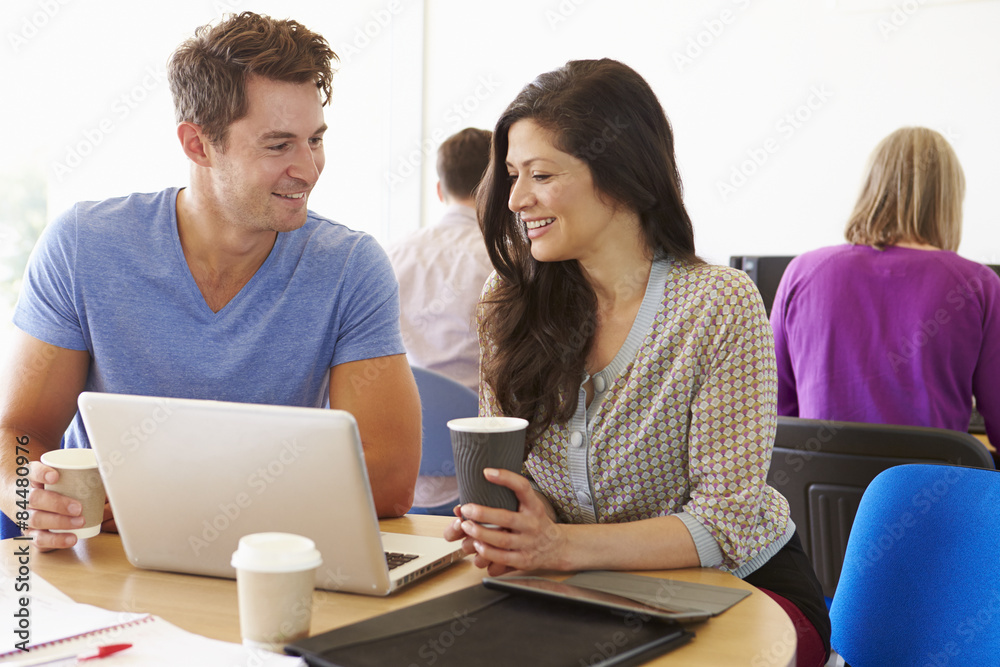 Two Mature Students Working Together Using Laptop Two Mature Students Working Together Using Laptop