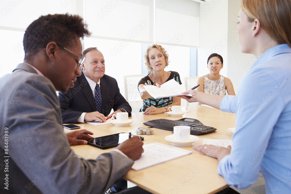 Five Businesspeople Having Meeting In Boardroom Five Businesspeople Having Meeting In Boardroom