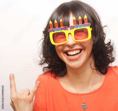 young happy woman with big orange sunglasses
