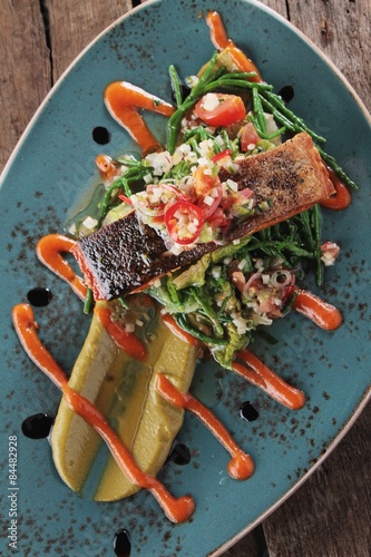 salmon steak plated meal photo