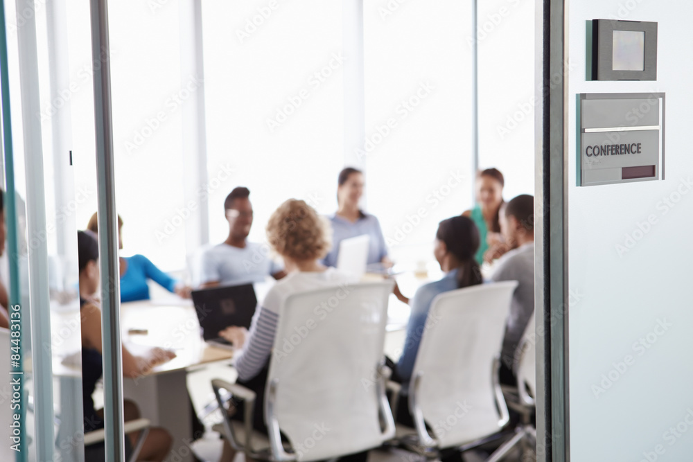 Fototapeta premium View Through Door Of Conference Room To Business Meeting