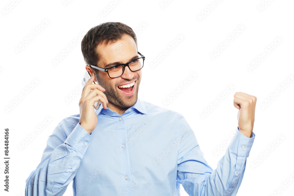 Successful gesturing business man with mobile Successful gesturing business man with mobile