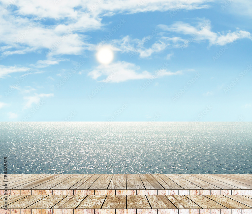 Sea and sky in the daytime and wood slabs arranged in perspective background for design.