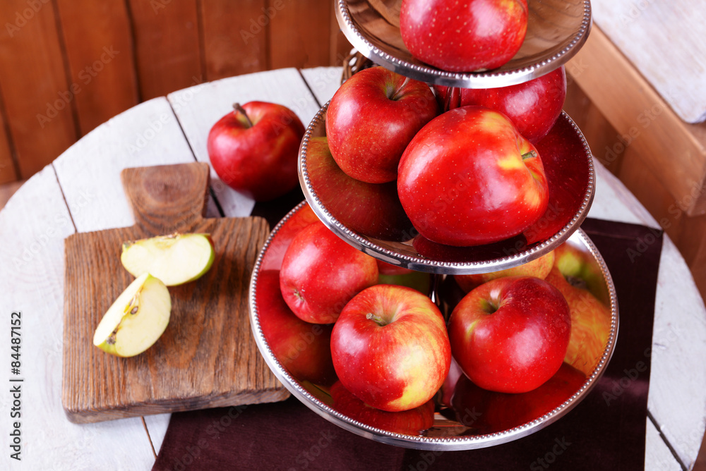 Tasty ripe apples on serving tray on table close up Tasty ripe apples on serving tray on table close up