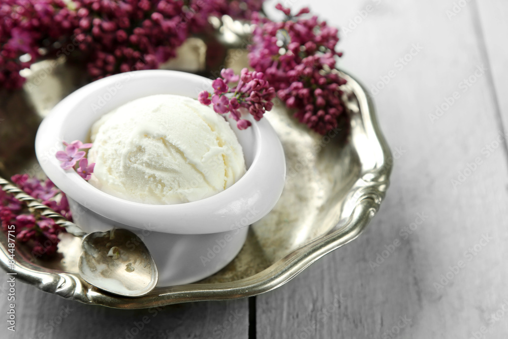 Beautiful composition with tasty ice cream and lilac flowers Beautiful composition with tasty ice cream and lilac flowers