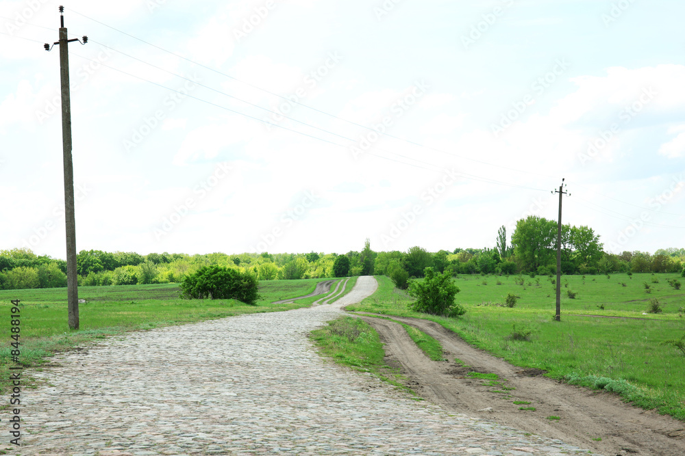 Country road over blue sky background