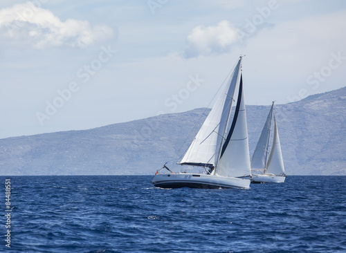 Sailing in the wind through the waves at the Aegean Sea. 