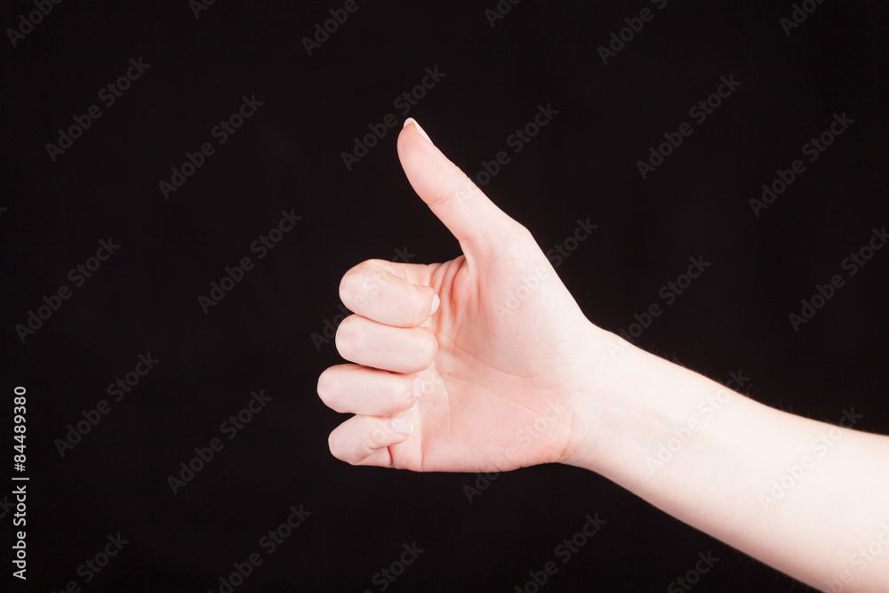 Approval thumbs up like sign as hand gesture Approval thumbs up like sign as hand gesture