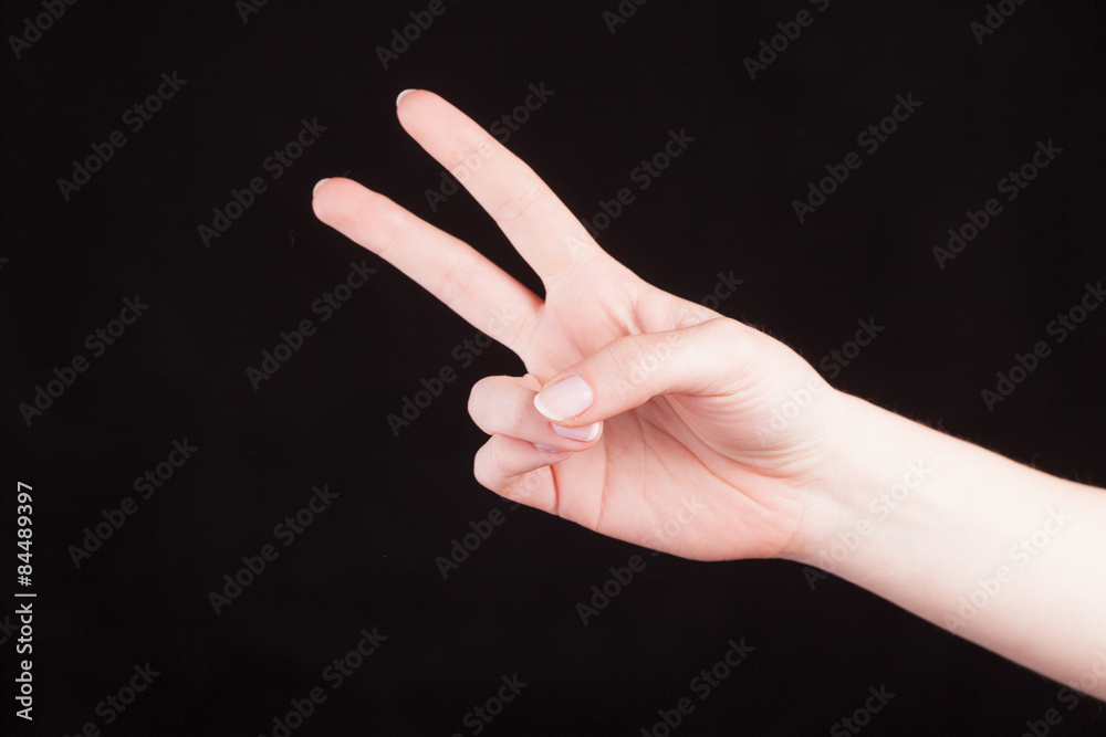 Counting gesture, women's hand showing two fingers Counting gesture, women's hand showing two fingers