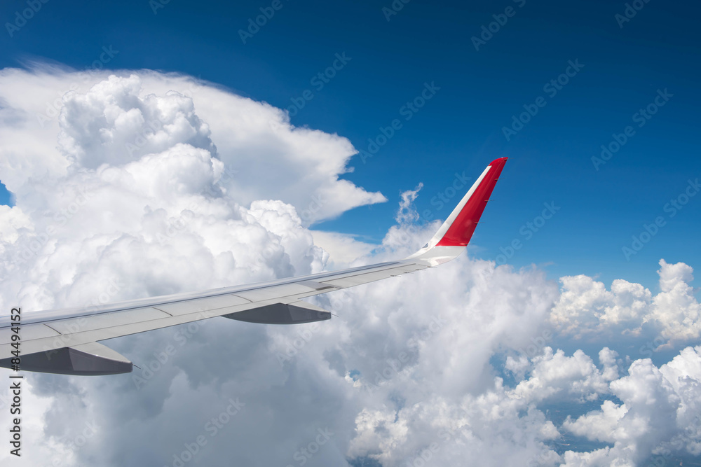 Fototapeta premium Wing of an airplane flying