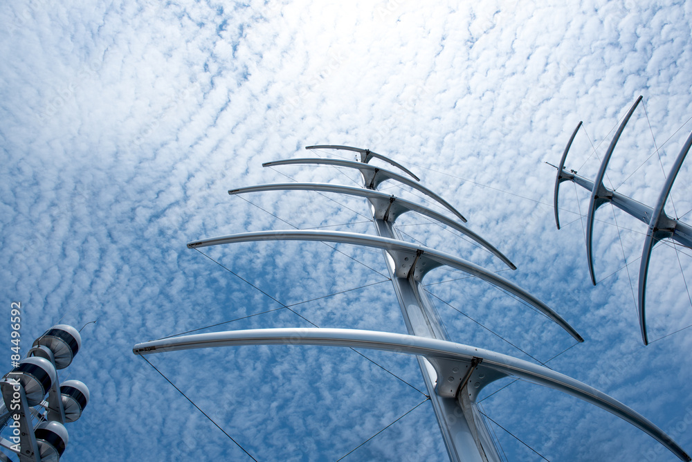 Masts like Herringbone under blue sky and clouds Masts like Herringbone under blue sky and clouds