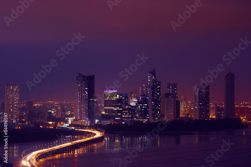 Panama City Night Skyline With Car Traffic On Highway