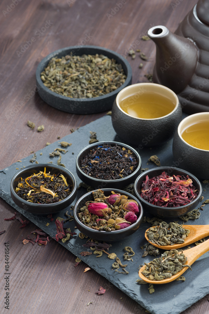 assortment of fragrant dried teas and green tea, vertical assortment of fragrant dried teas and green tea, vertical