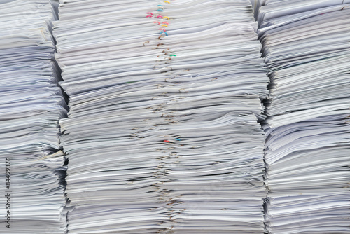 Billede på lærred Pile of documents on desk stack up high