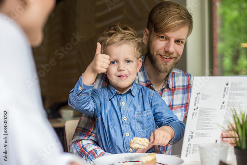 Father and son together in cafe. Family. Father's Day
