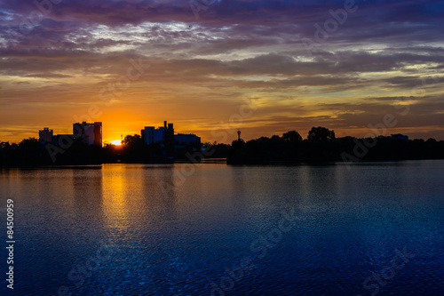 motor boat on lake at colorful sunset 