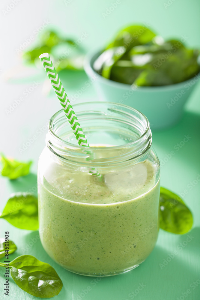 healthy green smoothie with spinach mango banana in glass jars healthy green smoothie with spinach mango banana in glass jars