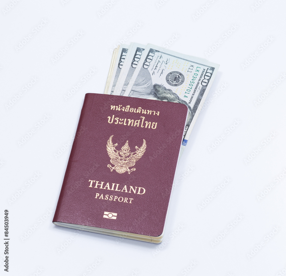 Thai passport book with dollar banknote