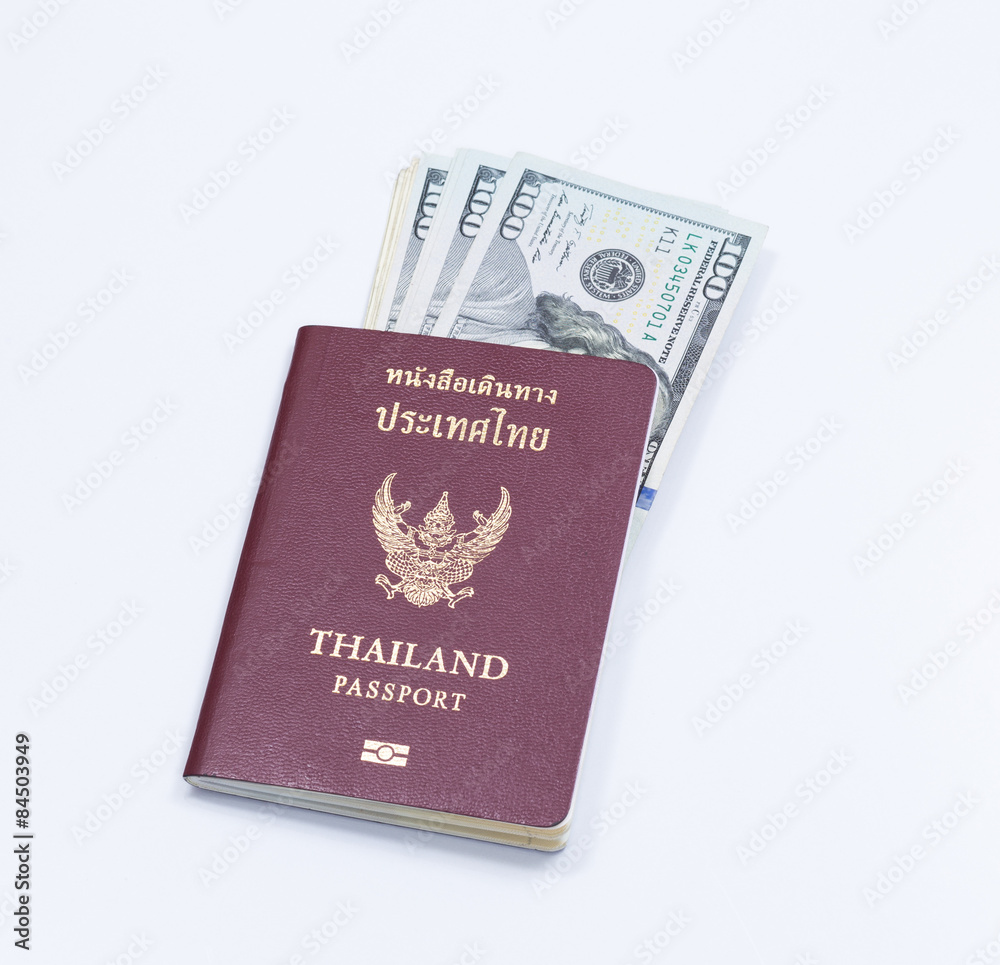 Thai passport book with dollar banknote Thai passport book with dollar banknote