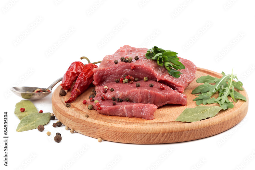 Meat on a cutting board isolated on white background.