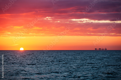 Oil platform in sunrise time