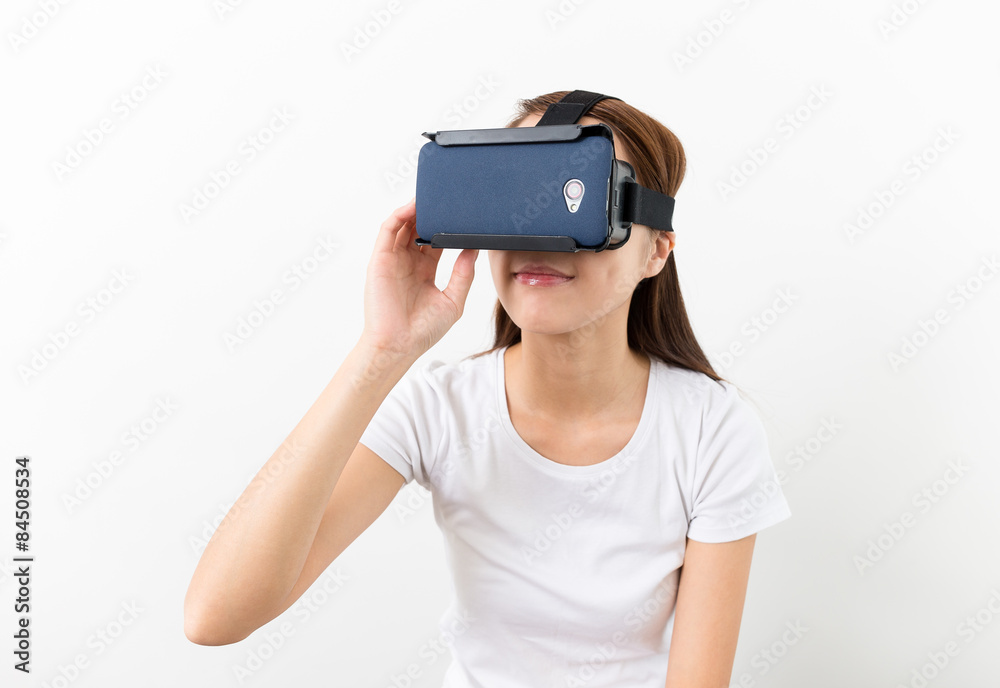 Woman hand touch on the virtual reality headset
