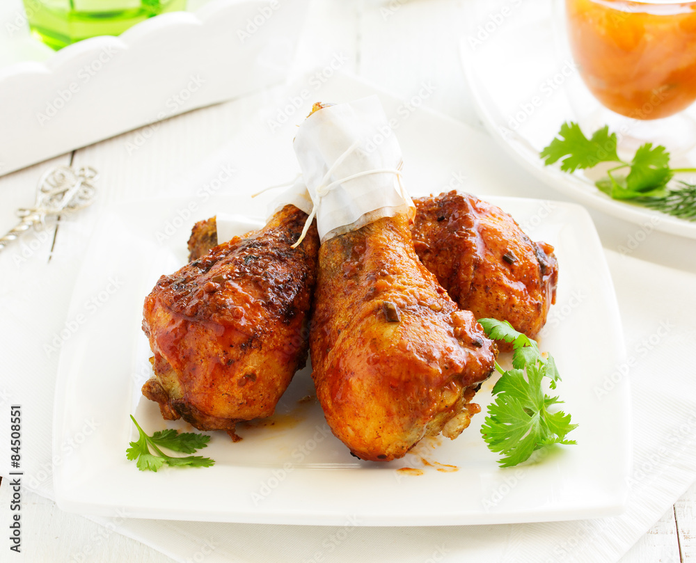 Roasted chicken legs with barbecue sauce with mango chutney. Roasted chicken legs with barbecue sauce with mango chutney.