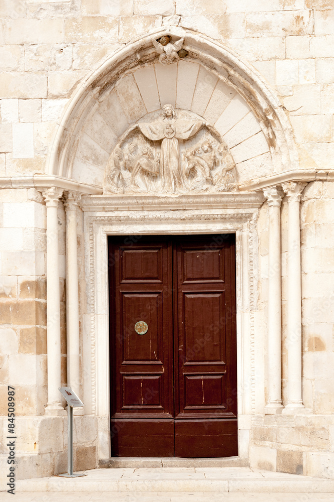 Entrance to the church of Assumption of the Blessed Virgin Mary in Pag, Croatia