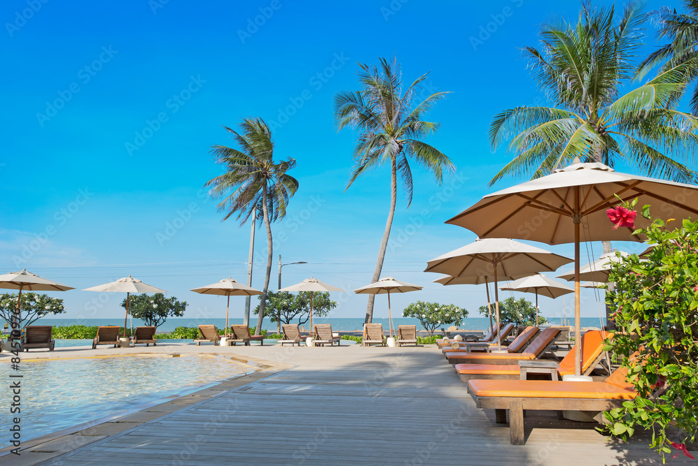 Perfect beach swimming pool with tropical resort relax.
