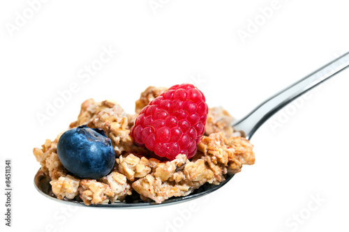 Macro close up of spoon with fruit muesli. photo