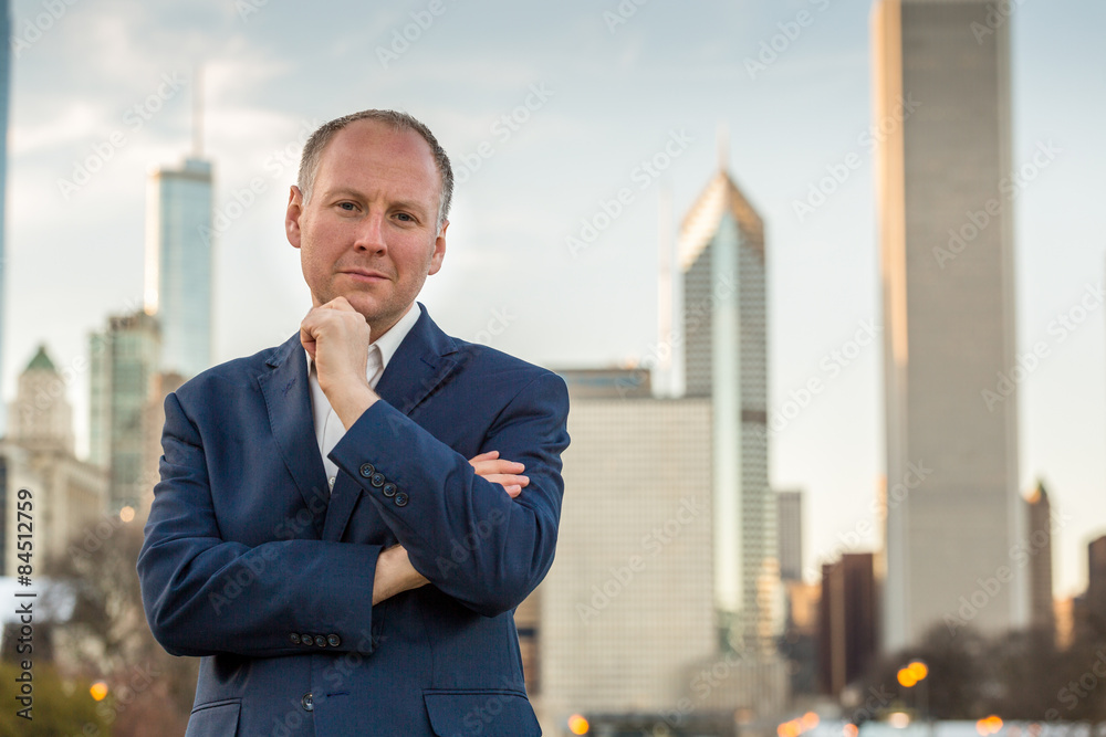 Successful businessman among office buildings. Successful businessman among office buildings.