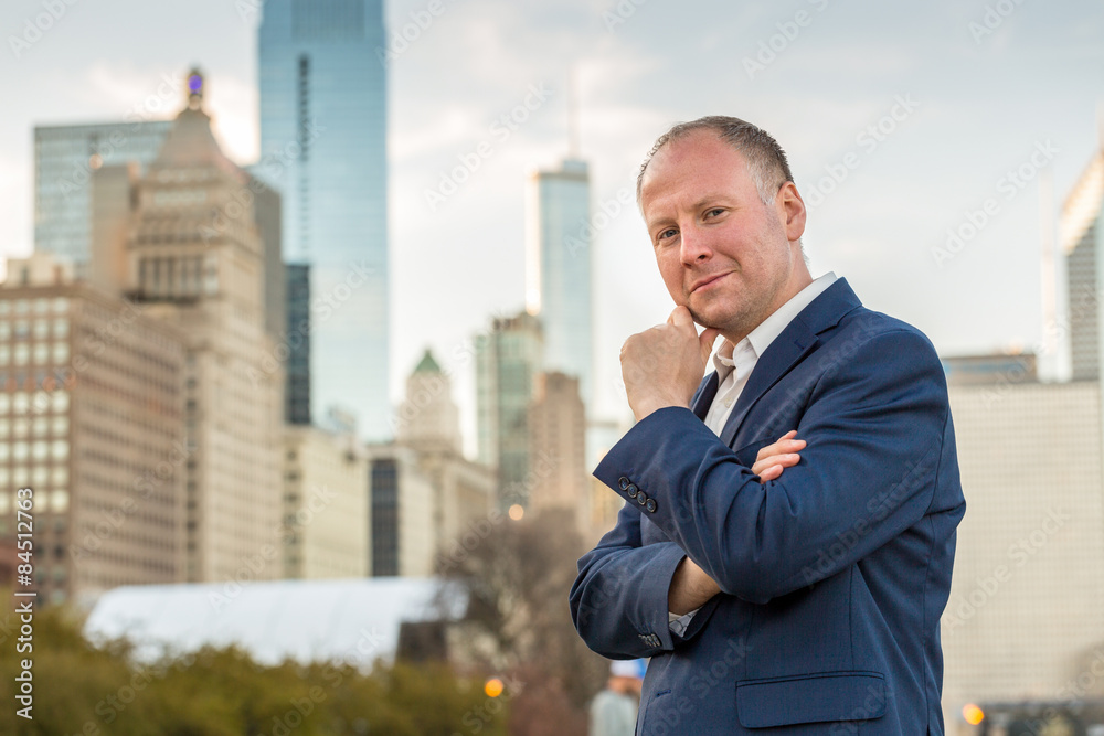 Successful businessman among office buildings. Successful businessman among office buildings.