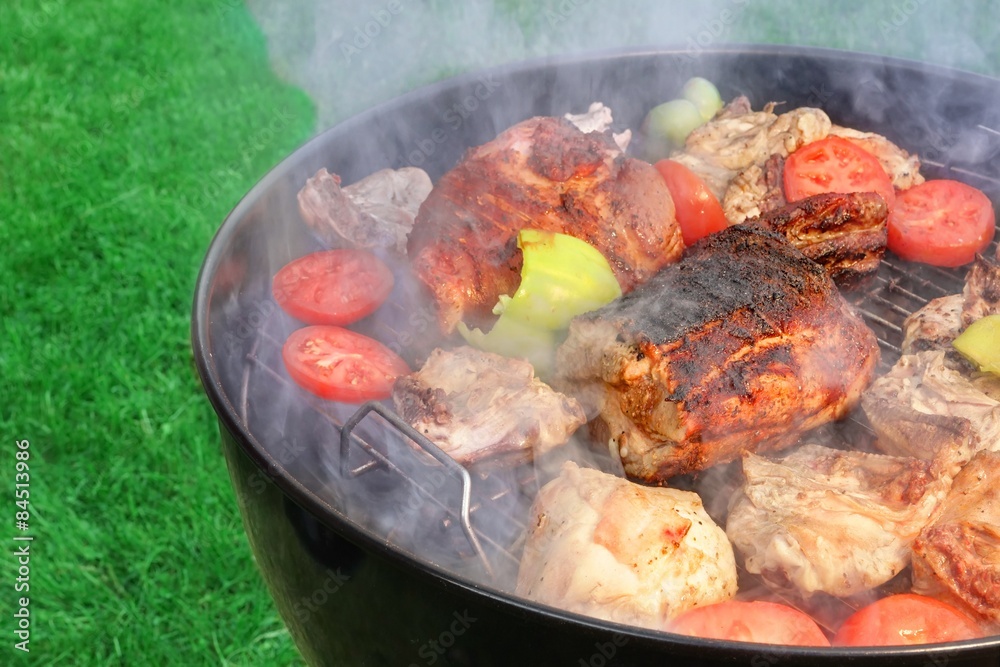 Meat And Vegetables Mix On The Hot BBQ Grill