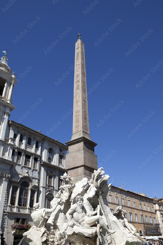 Italy. Rome. Navon Square (Piazza Navona). Fountain of the Four Rivers (Fontana dei Quattro Fiumi) before Saint Agnese in Agone..