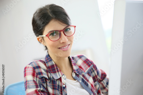 Portrait of office worker with eyeglasses on
